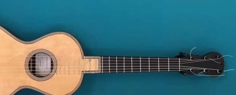 En klassisk 6-strengers gitar på blå bakgrunn